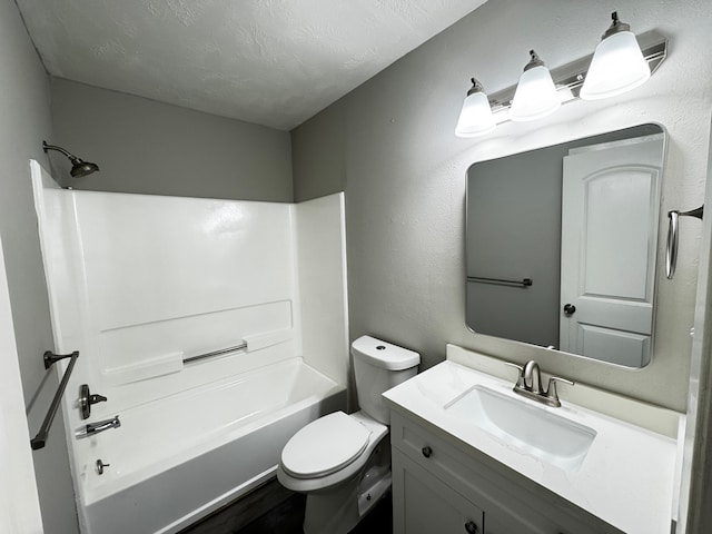 full bathroom with vanity, toilet, a textured ceiling, and bathtub / shower combination