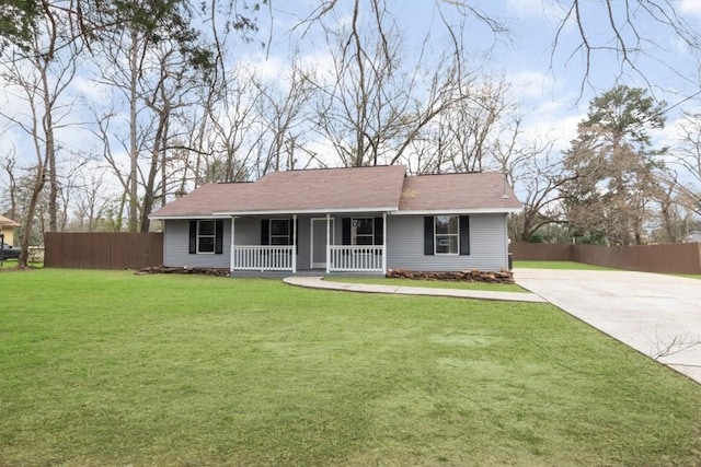 ranch-style house with a porch, a front yard, and fence