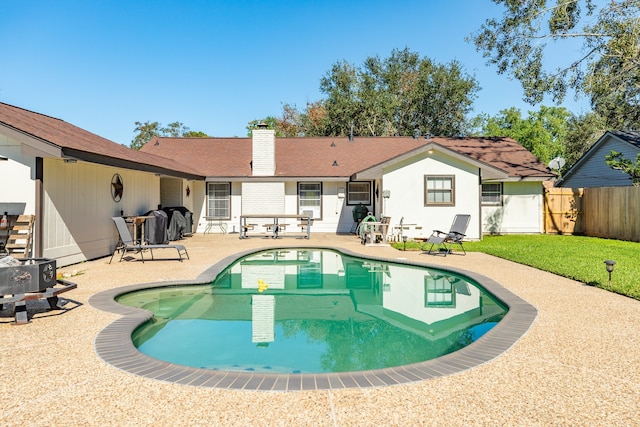 rear view of property featuring a patio