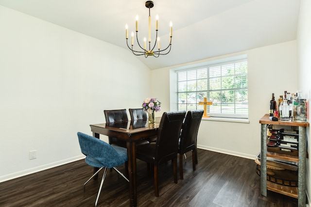 dining space with lofted ceiling, dark wood-type flooring, and a chandelier