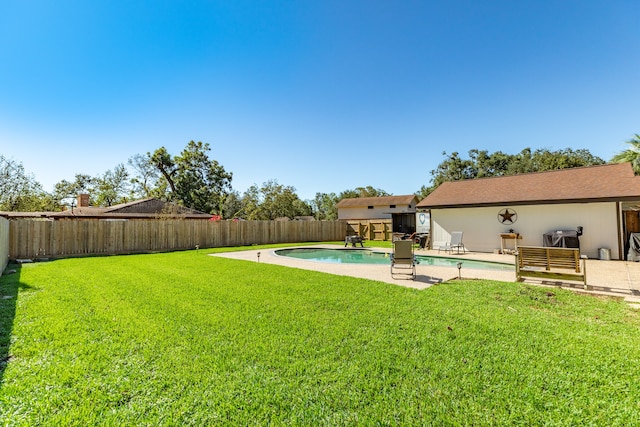 view of yard with a fenced in pool and a patio