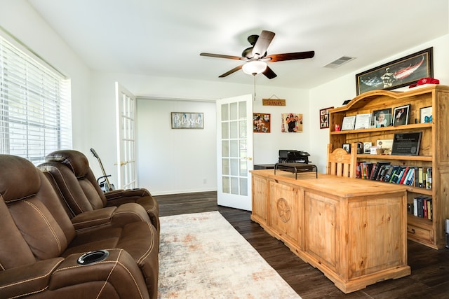 office with dark hardwood / wood-style floors, ceiling fan, and french doors