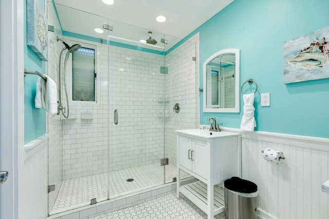 bathroom featuring tile patterned floors, vanity, and walk in shower