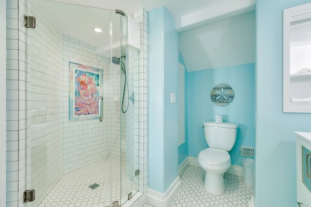 bathroom featuring tile patterned floors, vanity, toilet, and an enclosed shower