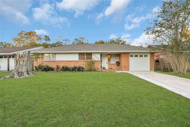 ranch-style house featuring a front yard and a garage