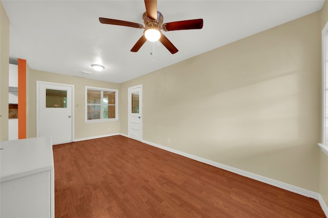 unfurnished living room with ceiling fan and hardwood / wood-style flooring