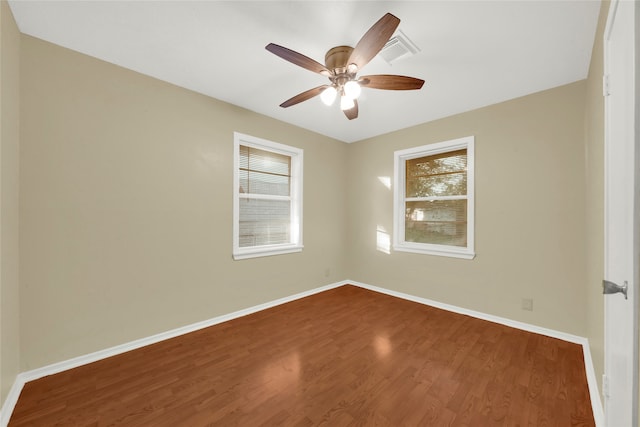 unfurnished room with ceiling fan and wood-type flooring