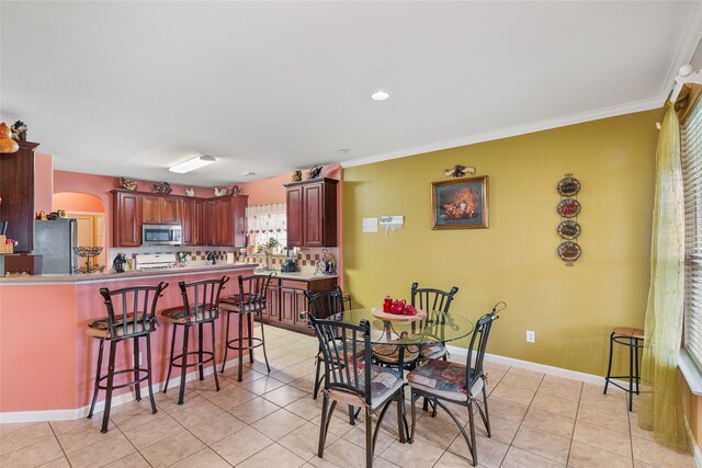 tiled dining space with ornamental molding