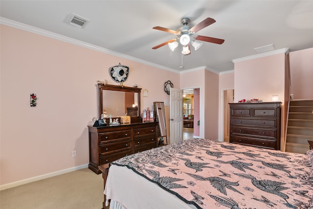 bedroom featuring ceiling fan, light colored carpet, and crown molding