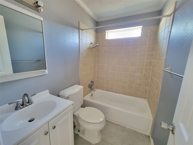 full bathroom with tile patterned floors, ornamental molding, vanity, tiled shower / bath combo, and toilet