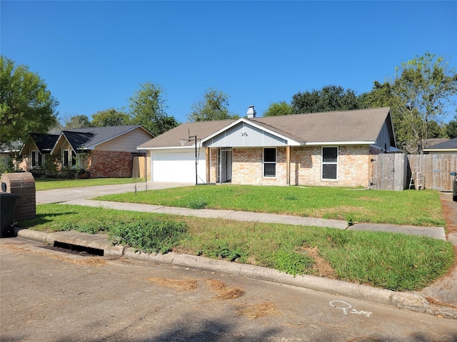 ranch-style home with a front yard and a garage