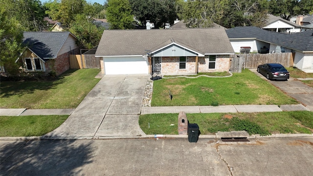 view of front of home featuring a garage and a front yard