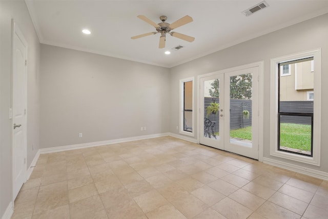 tiled spare room with ceiling fan, ornamental molding, and french doors