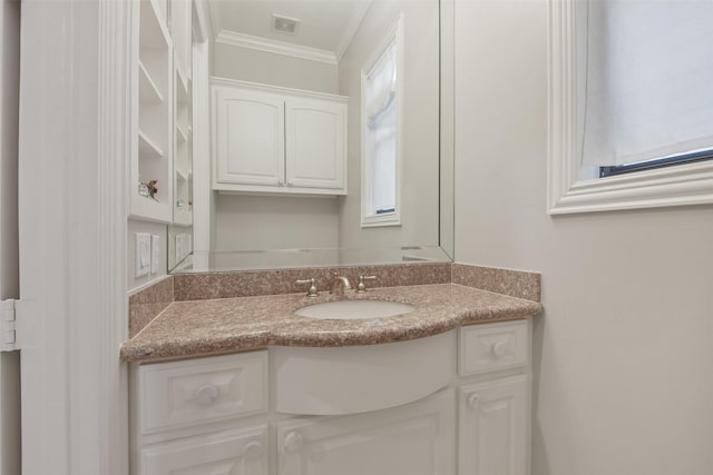 bathroom featuring vanity and ornamental molding