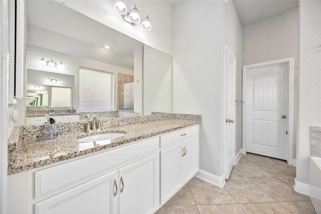 bathroom with tile patterned flooring, vanity, and an enclosed shower