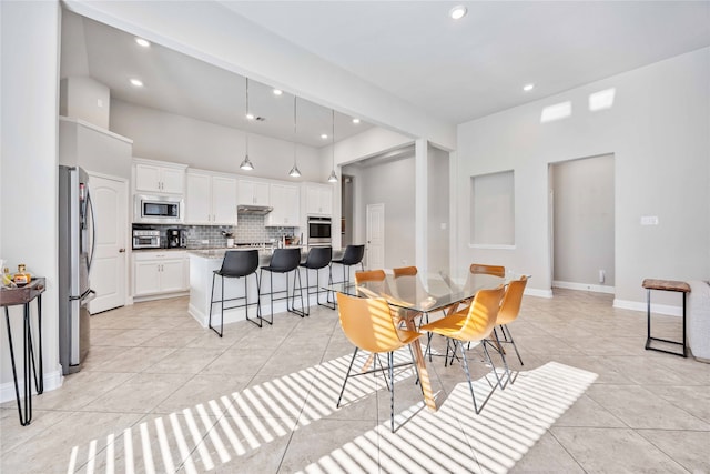 dining room featuring light tile patterned floors