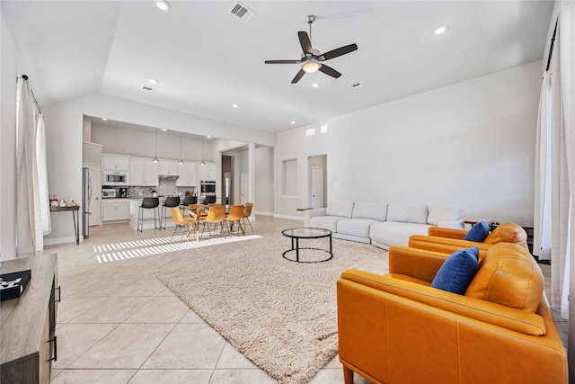 tiled living room with vaulted ceiling and ceiling fan