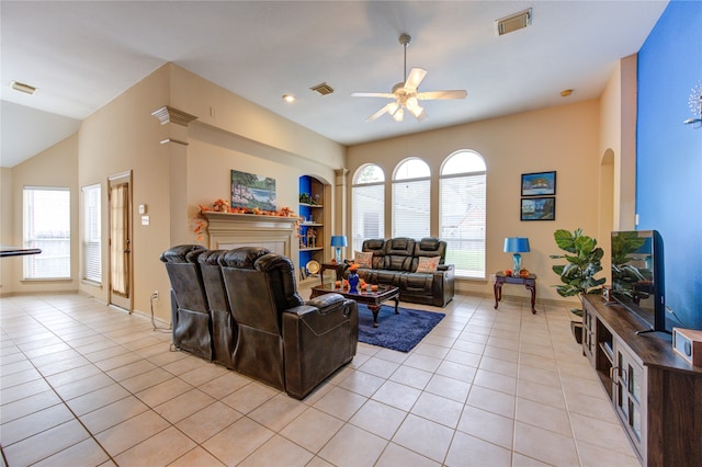 tiled living room with ceiling fan