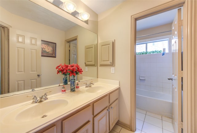 bathroom with tile patterned flooring and vanity