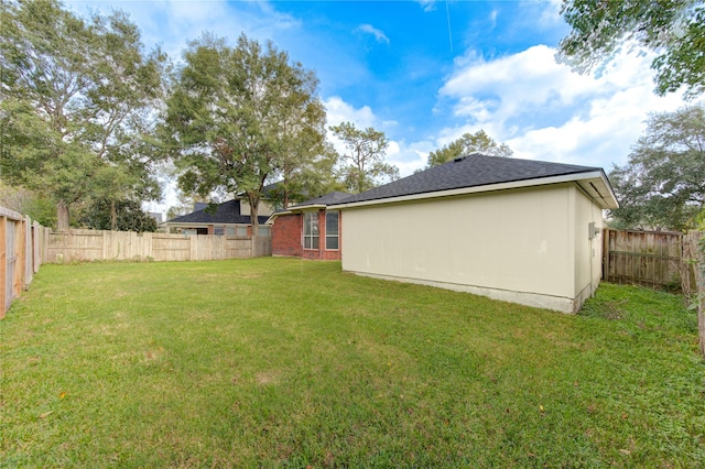 view of yard featuring a fenced backyard