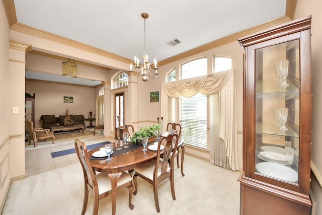 dining room featuring crown molding, light colored carpet, visible vents, and a chandelier