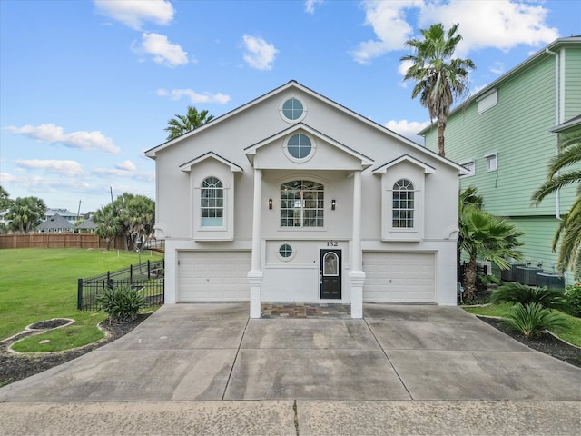 view of front property with a front yard and a garage