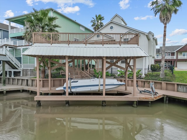 view of dock with a deck with water view