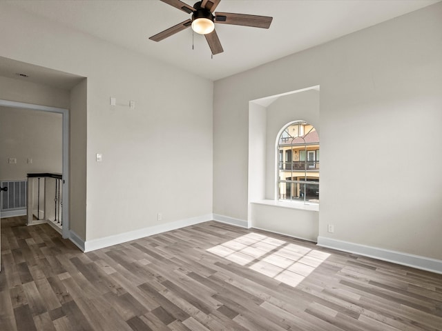 spare room featuring hardwood / wood-style flooring and ceiling fan