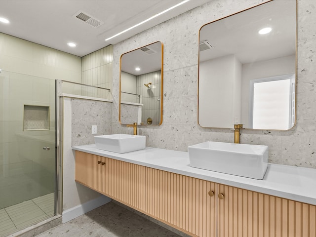 bathroom with vanity and an enclosed shower