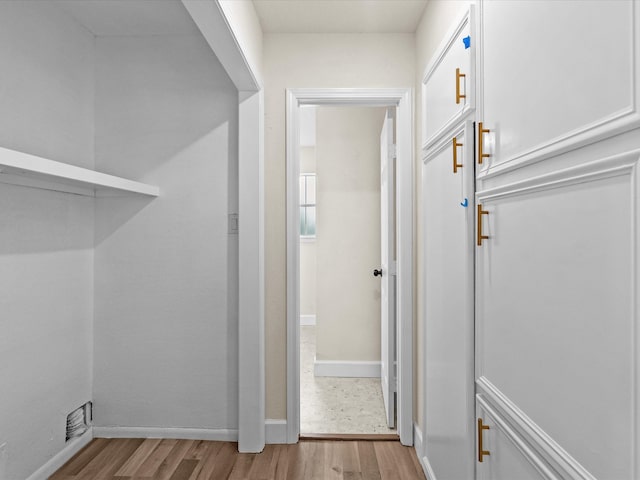 corridor featuring light hardwood / wood-style floors