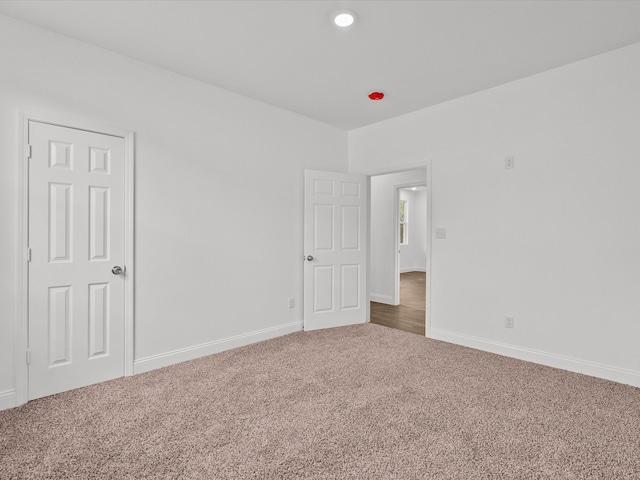 spare room featuring carpet floors