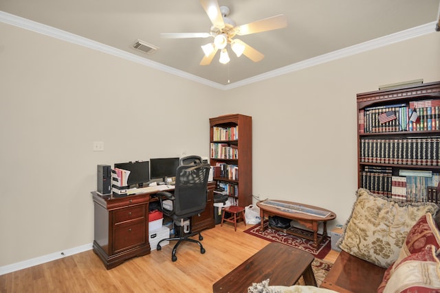 office with light wood-type flooring and ornamental molding