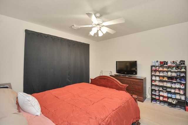 bedroom with ceiling fan and light colored carpet