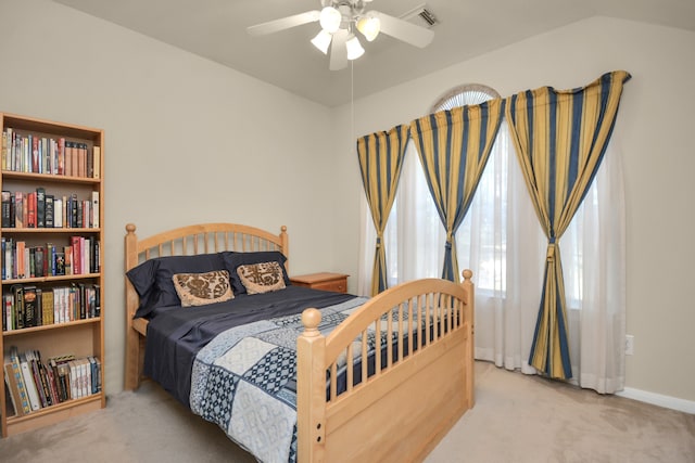 carpeted bedroom featuring ceiling fan and lofted ceiling