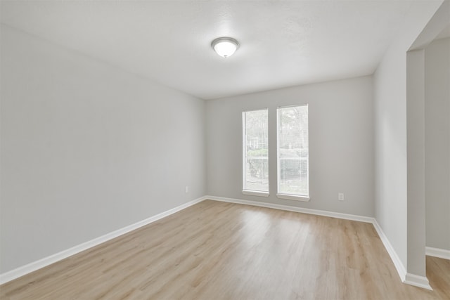 unfurnished room featuring light hardwood / wood-style flooring