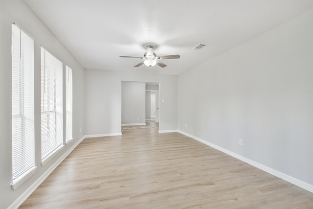 unfurnished room with light hardwood / wood-style floors and ceiling fan