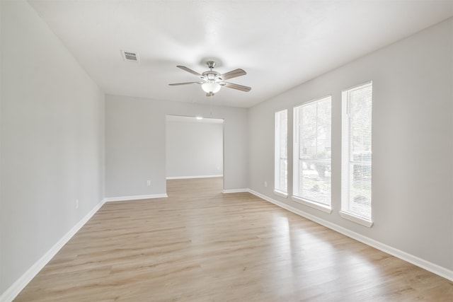 unfurnished room featuring light hardwood / wood-style floors and ceiling fan