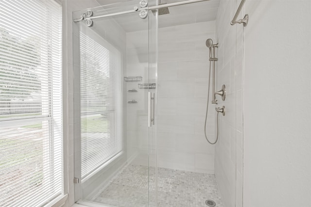 bathroom with a healthy amount of sunlight and an enclosed shower