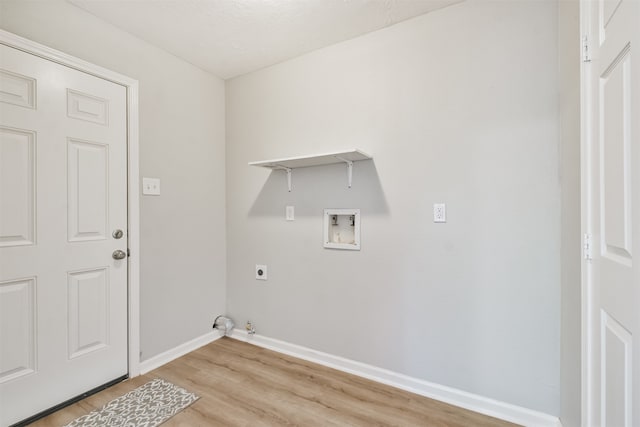 laundry room featuring electric dryer hookup, light hardwood / wood-style floors, gas dryer hookup, and hookup for a washing machine