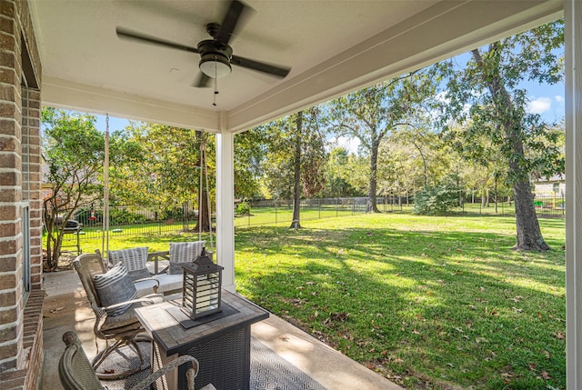 view of yard with a patio area and ceiling fan