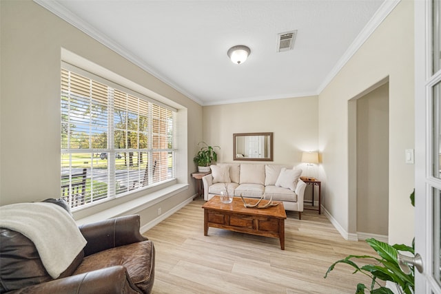 living room with light wood-type flooring and crown molding