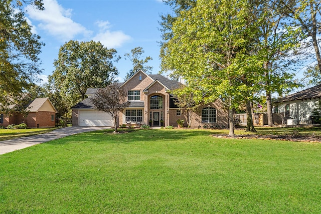 view of front facade featuring a front yard and a garage