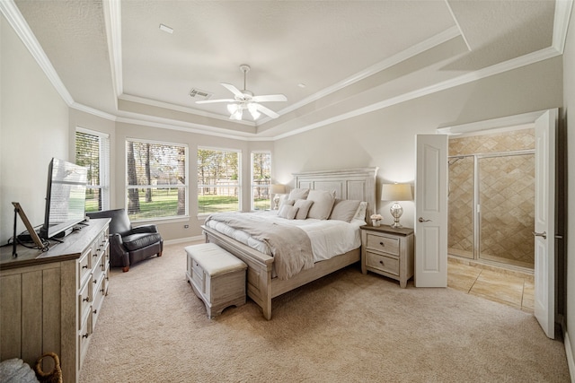 bedroom with a tray ceiling, ceiling fan, and light colored carpet