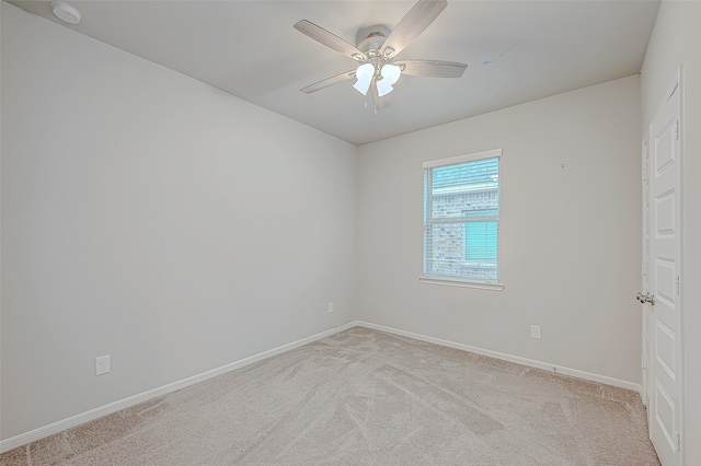 unfurnished room with light carpet and ceiling fan