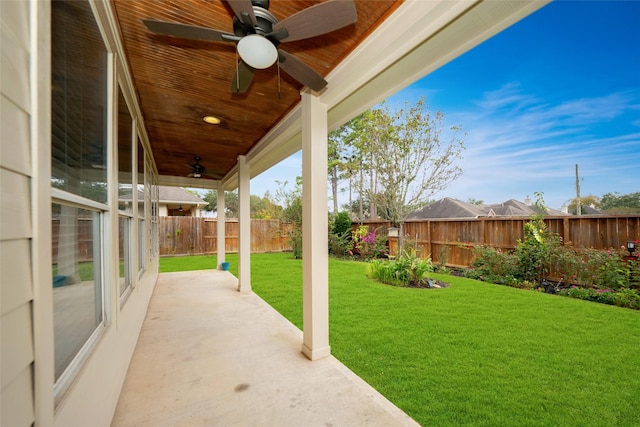 view of yard featuring a patio area and ceiling fan