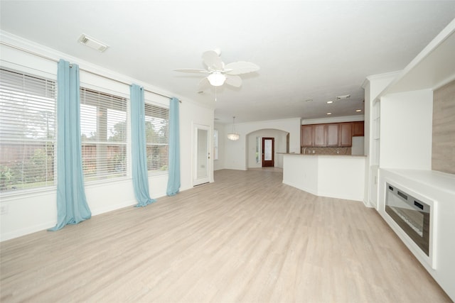 unfurnished living room featuring light hardwood / wood-style floors and ceiling fan