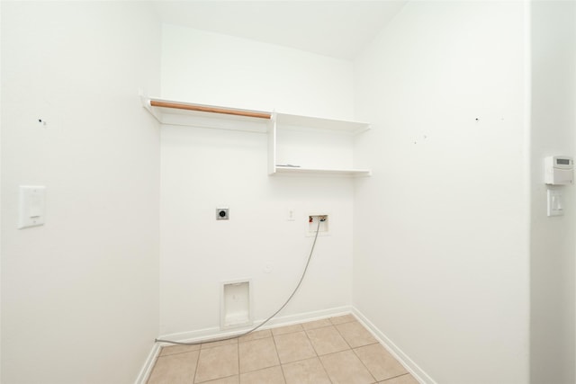 laundry area with washer hookup, light tile patterned floors, gas dryer hookup, and electric dryer hookup