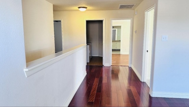 hallway featuring dark wood-type flooring