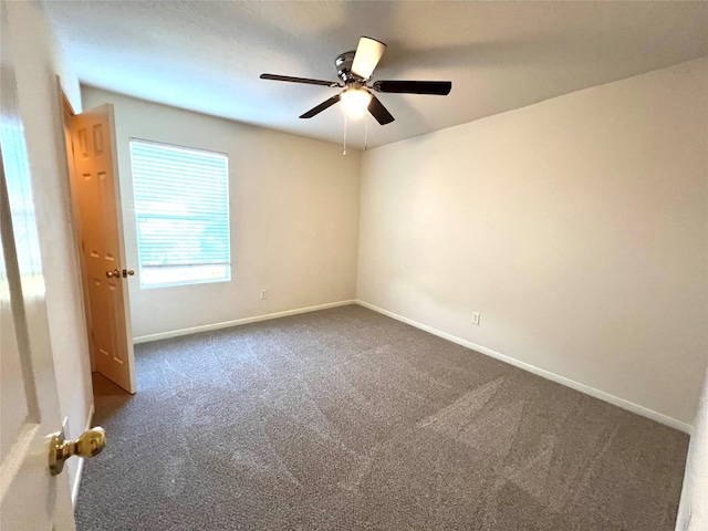 carpeted empty room with ceiling fan