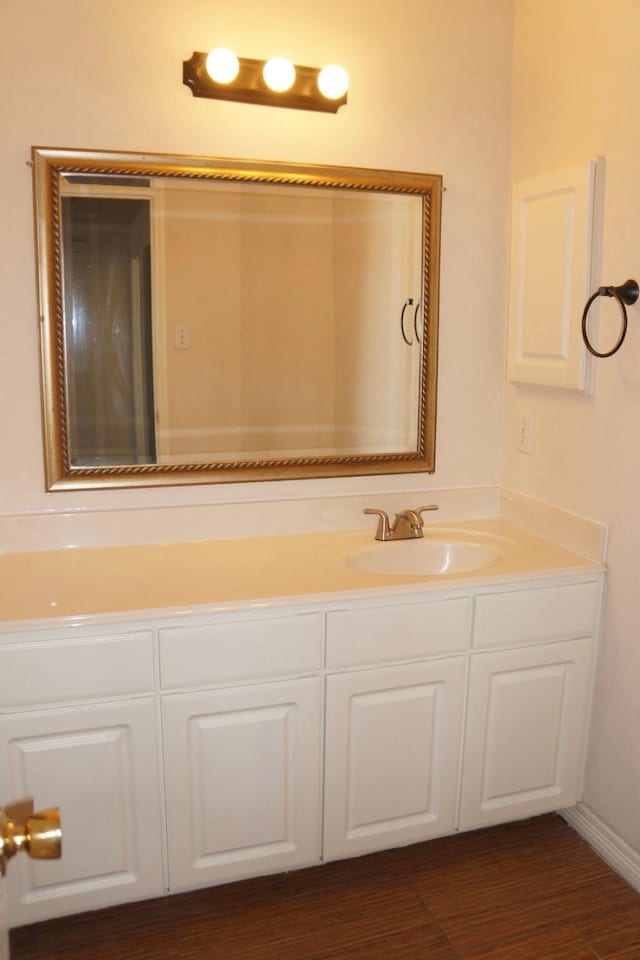 bathroom featuring vanity and hardwood / wood-style flooring